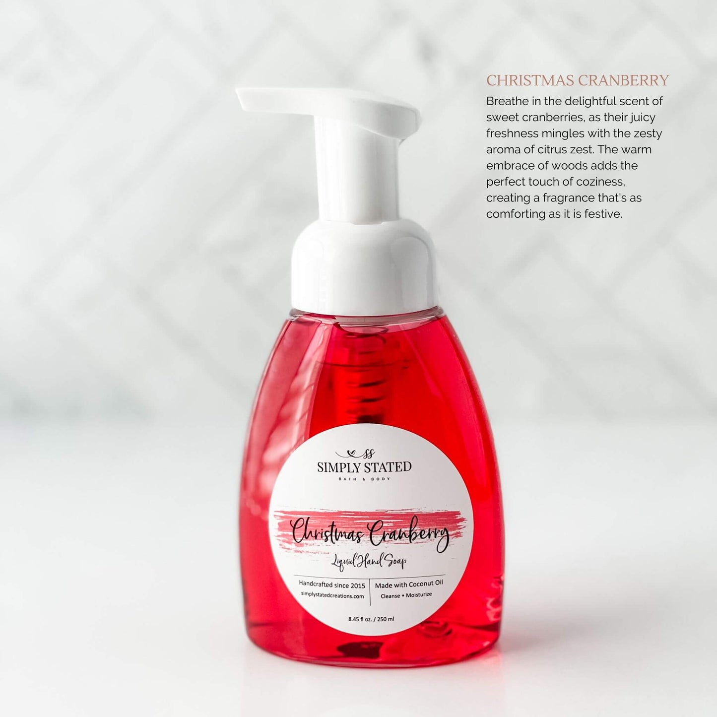 2023 Christmas Collection Liquid Hand Soap in Christmas Cranberry (red color). Breathe in the delightful scent of sweet cranberries, as their juicy freshness mingles with the zesty aroma of citrus zest. The warm embrace of woods adds the perfect touch of coziness, creating a fragrance that's as comforting as it is festive.